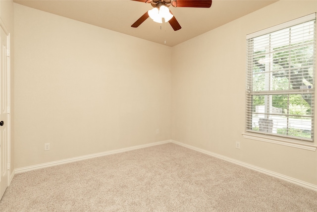 unfurnished room with ceiling fan and carpet floors