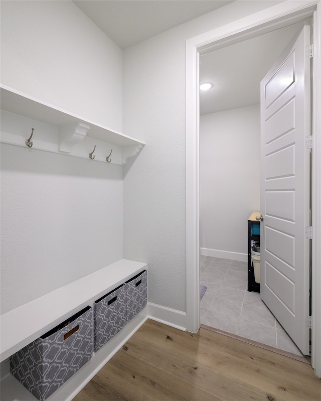 mudroom with light hardwood / wood-style floors