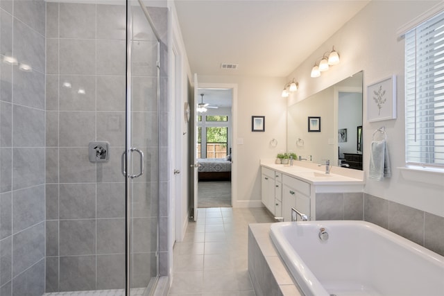 bathroom featuring tile patterned flooring, ceiling fan, independent shower and bath, and vanity