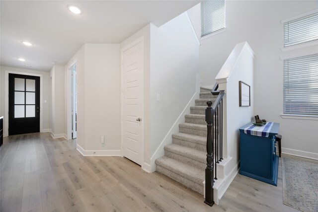 foyer with light hardwood / wood-style floors