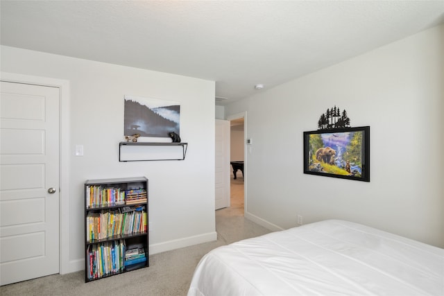 bedroom featuring light colored carpet