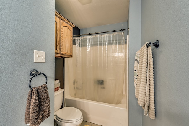 bathroom featuring toilet and shower / bath combo