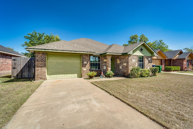 ranch-style house featuring a garage and a front lawn