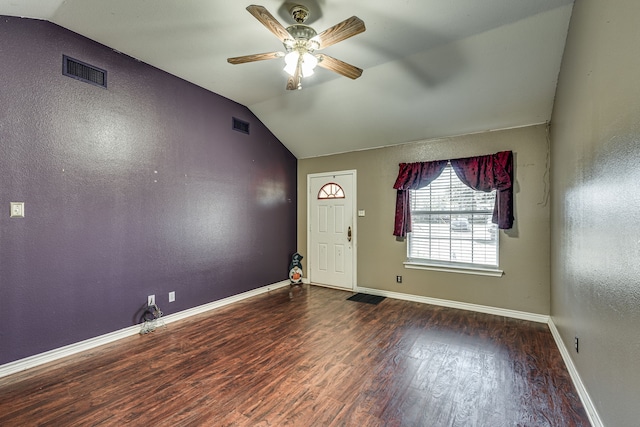 foyer entrance with lofted ceiling, dark hardwood / wood-style floors, and ceiling fan