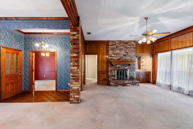 unfurnished living room featuring a fireplace, wooden walls, ceiling fan, carpet, and lofted ceiling