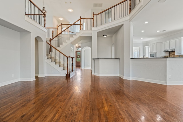 unfurnished living room with wood-type flooring