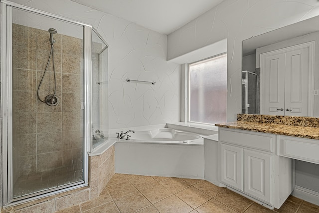 bathroom featuring vanity, tile patterned floors, and shower with separate bathtub