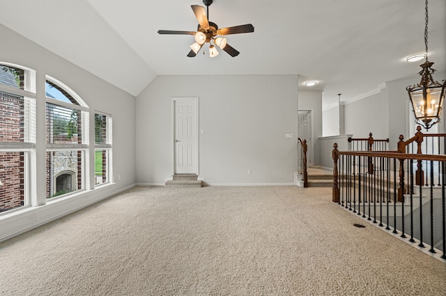 spare room with carpet flooring, ceiling fan, and vaulted ceiling