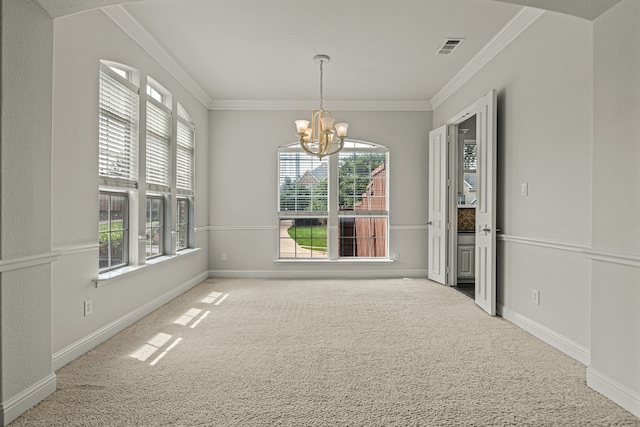 unfurnished dining area with crown molding, light colored carpet, and a notable chandelier