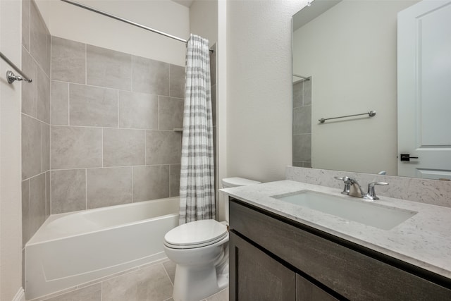 full bathroom featuring shower / tub combo, vanity, toilet, and tile patterned floors