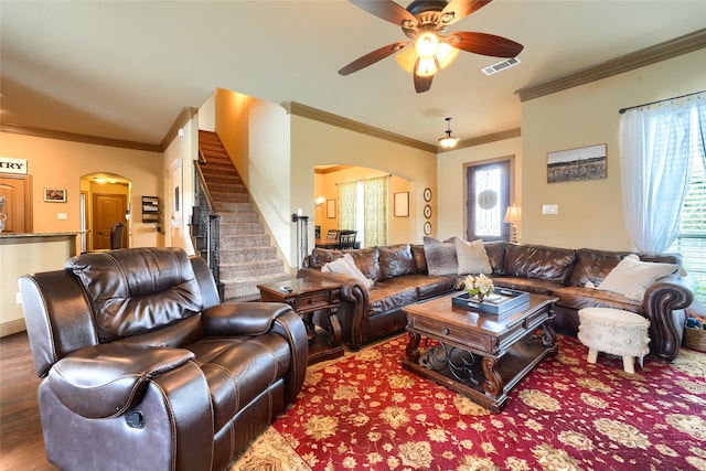 living room with ceiling fan, crown molding, and hardwood / wood-style flooring