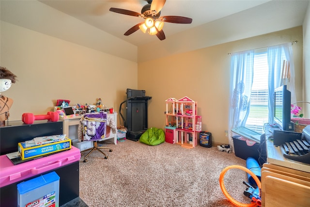 recreation room featuring ceiling fan, carpet, and lofted ceiling