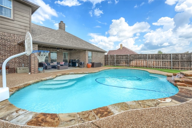 view of pool featuring an outdoor living space and a patio