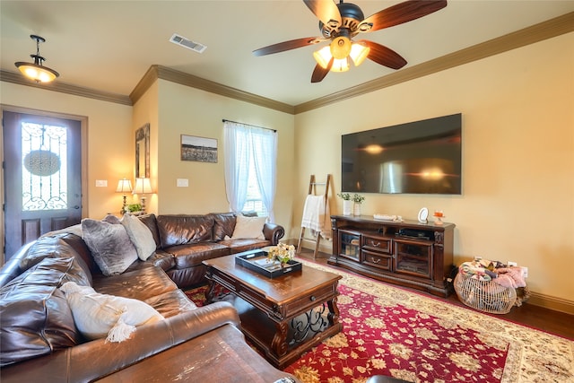 living room featuring ceiling fan, wood-type flooring, and ornamental molding