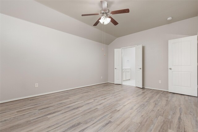 unfurnished bedroom featuring vaulted ceiling, ceiling fan, and light hardwood / wood-style floors