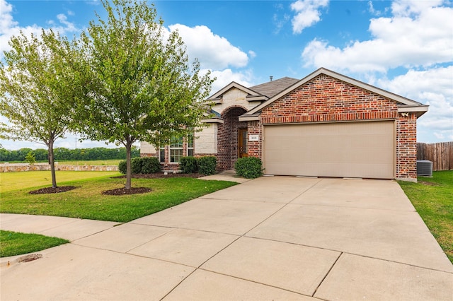 view of front facade with a garage and a front lawn