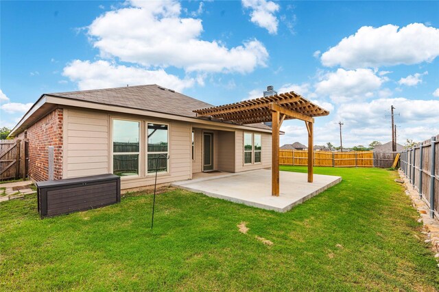 rear view of house with a lawn, a patio, and a pergola