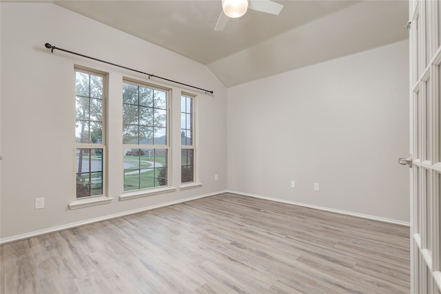 unfurnished room featuring lofted ceiling, light hardwood / wood-style flooring, and ceiling fan