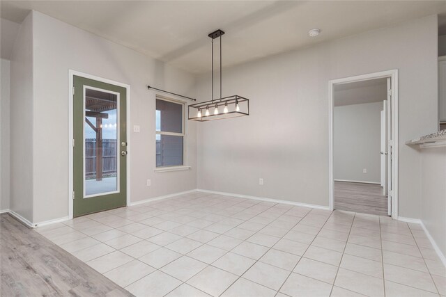 spare room featuring light hardwood / wood-style floors