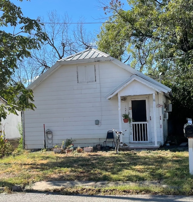 bungalow with a front lawn