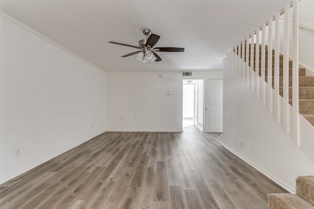 interior space featuring crown molding, ceiling fan, and hardwood / wood-style flooring