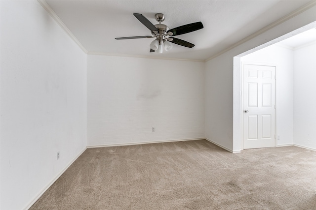 unfurnished room featuring ceiling fan, ornamental molding, and light carpet