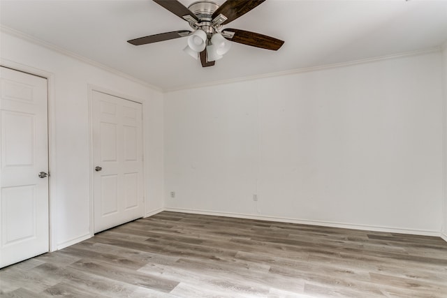 interior space with ceiling fan, crown molding, and light hardwood / wood-style flooring