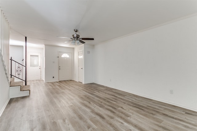 interior space featuring crown molding, ceiling fan, and light hardwood / wood-style floors