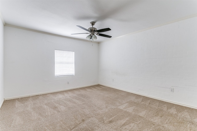 unfurnished room featuring light carpet, crown molding, and ceiling fan