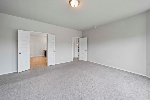 unfurnished bedroom featuring carpet