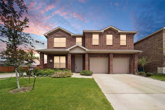 view of front facade featuring a lawn and a garage