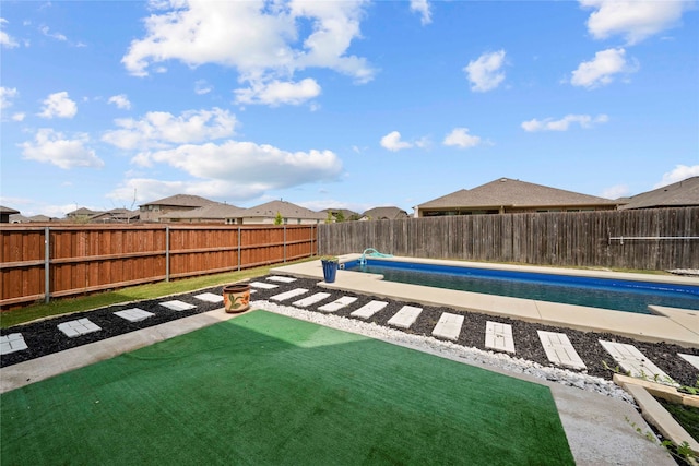 view of yard with a fenced in pool