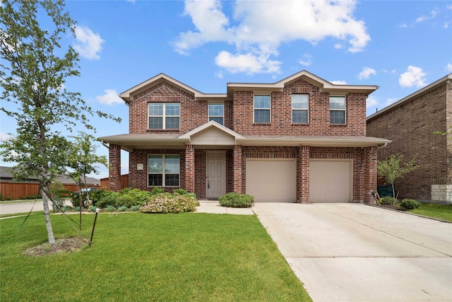 view of front of home featuring a front yard and a garage