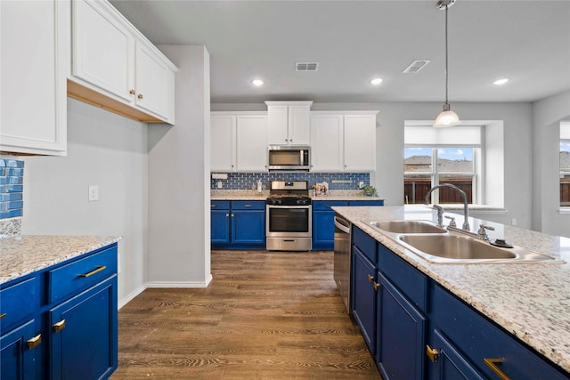 kitchen featuring appliances with stainless steel finishes, white cabinetry, dark hardwood / wood-style floors, sink, and blue cabinets