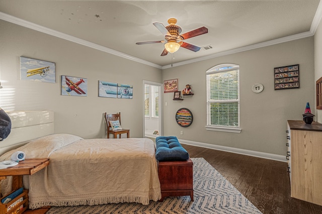 bedroom featuring ceiling fan, ornamental molding, and dark hardwood / wood-style flooring