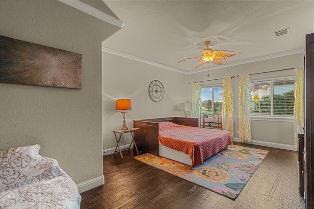 bedroom featuring ceiling fan, dark hardwood / wood-style floors, and crown molding