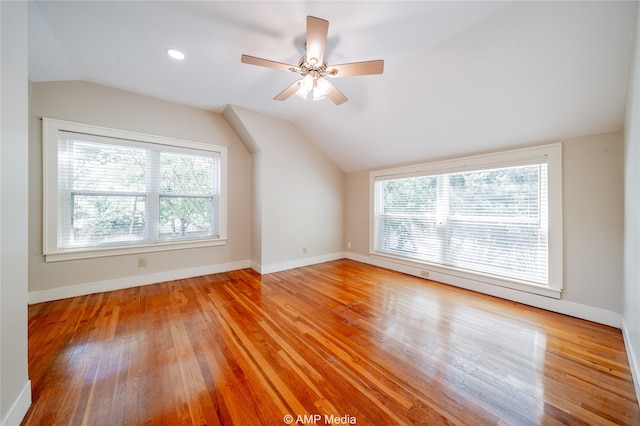 bonus room featuring light wood-type flooring, ceiling fan, and vaulted ceiling