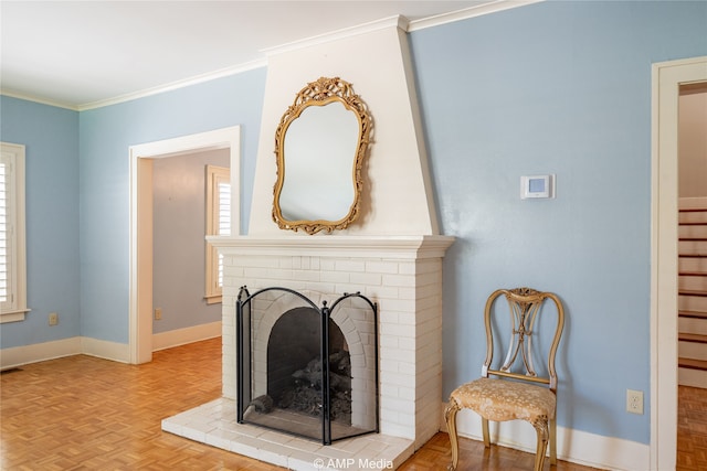 interior details with crown molding, a brick fireplace, and parquet flooring