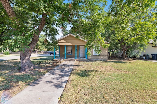 bungalow-style house with a front yard