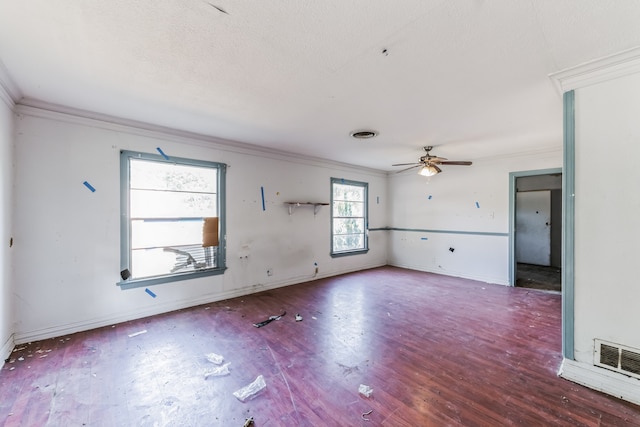 spare room featuring crown molding, hardwood / wood-style flooring, and ceiling fan