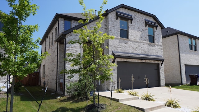 modern home featuring a garage and a front lawn