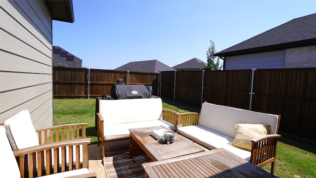 wooden terrace featuring an outdoor hangout area and a lawn