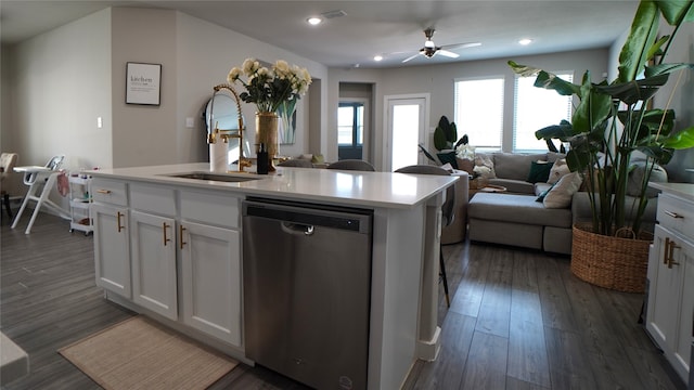 kitchen featuring dishwasher, dark hardwood / wood-style flooring, white cabinets, and a kitchen island with sink