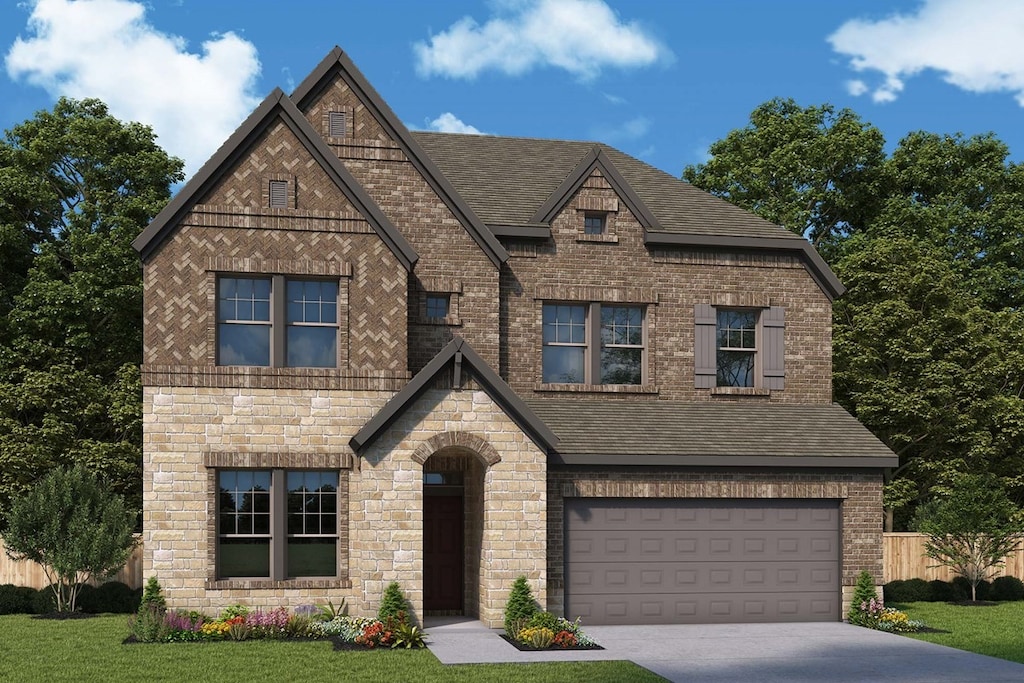 view of front of home with a garage and a front lawn