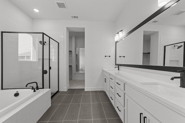 bathroom featuring tile patterned floors, separate shower and tub, and vanity