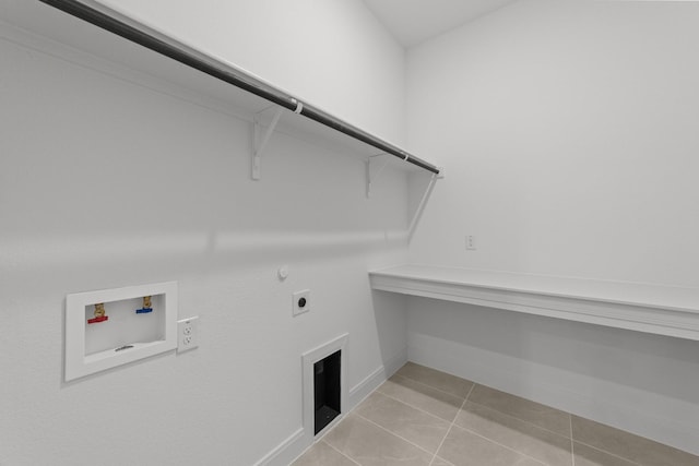 laundry room with gas dryer hookup, electric dryer hookup, washer hookup, and light tile patterned floors