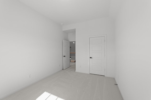 unfurnished bedroom featuring light colored carpet