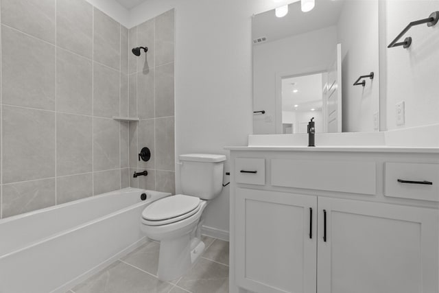 full bathroom with vanity, tile patterned flooring, tiled shower / bath combo, and toilet