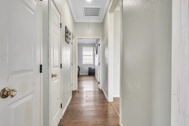 hallway featuring ornamental molding and dark hardwood / wood-style flooring