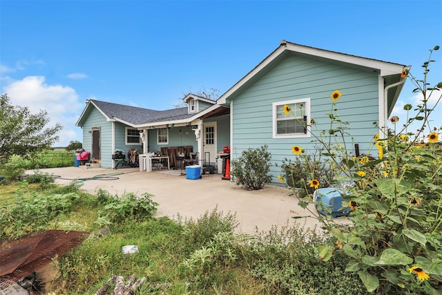 back of property with a patio area